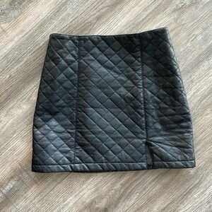 Leather black quilted skirt with slit
